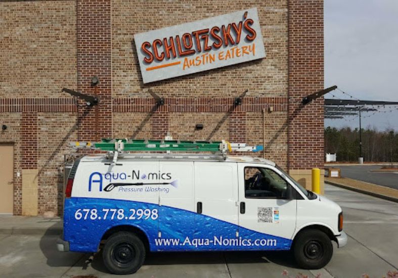 Aqua-Nomics Pressure Washing Van at Schlotzsky's Austin Eatery