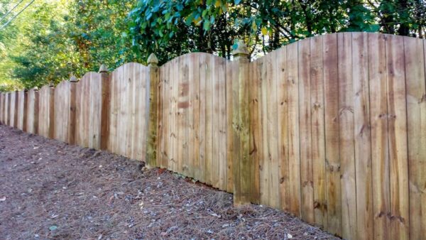 Wooden Fence With A Curved Top